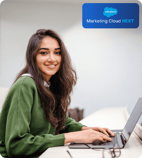 Professional working with Salesforce Marketing Cloud Next on laptop
